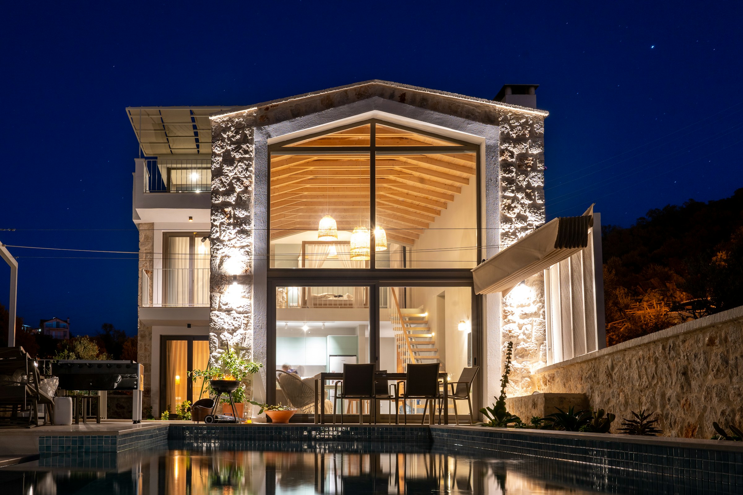 Warm evening light in a stone and glass residence